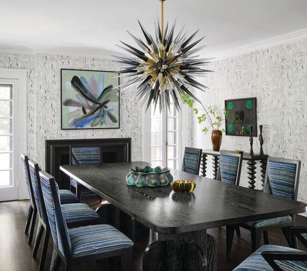 A striking Galerie Glustin chandelier sourced from 1st Dibs hangs over a custom dining table by Seer Studio. PHOTOGRAPHED BY DUSTIN HALLECK