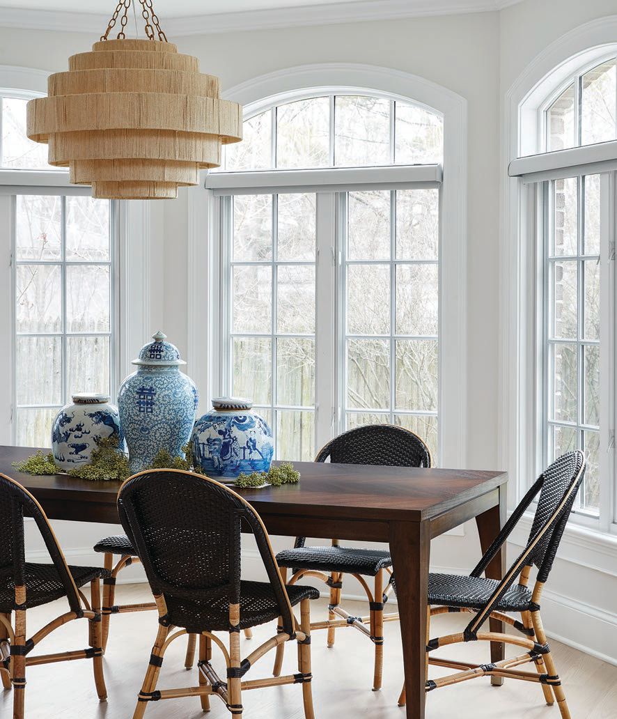 The airy breakfast room beckons with a Sunpan dining table, chairs by Industry West and chandelier by Palacek PHOTOGRAPHED BY DUSTIN HALLECK