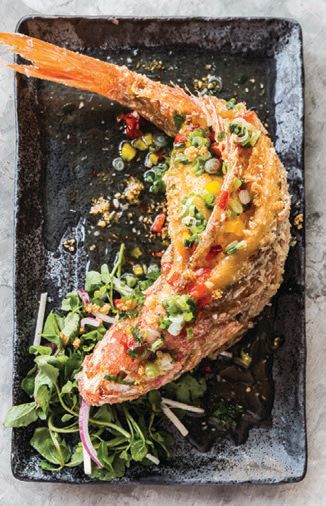 Ca Chien Saigon (crispy whole red snapper) is a perennial crowd-pleaser LE COLONIAL